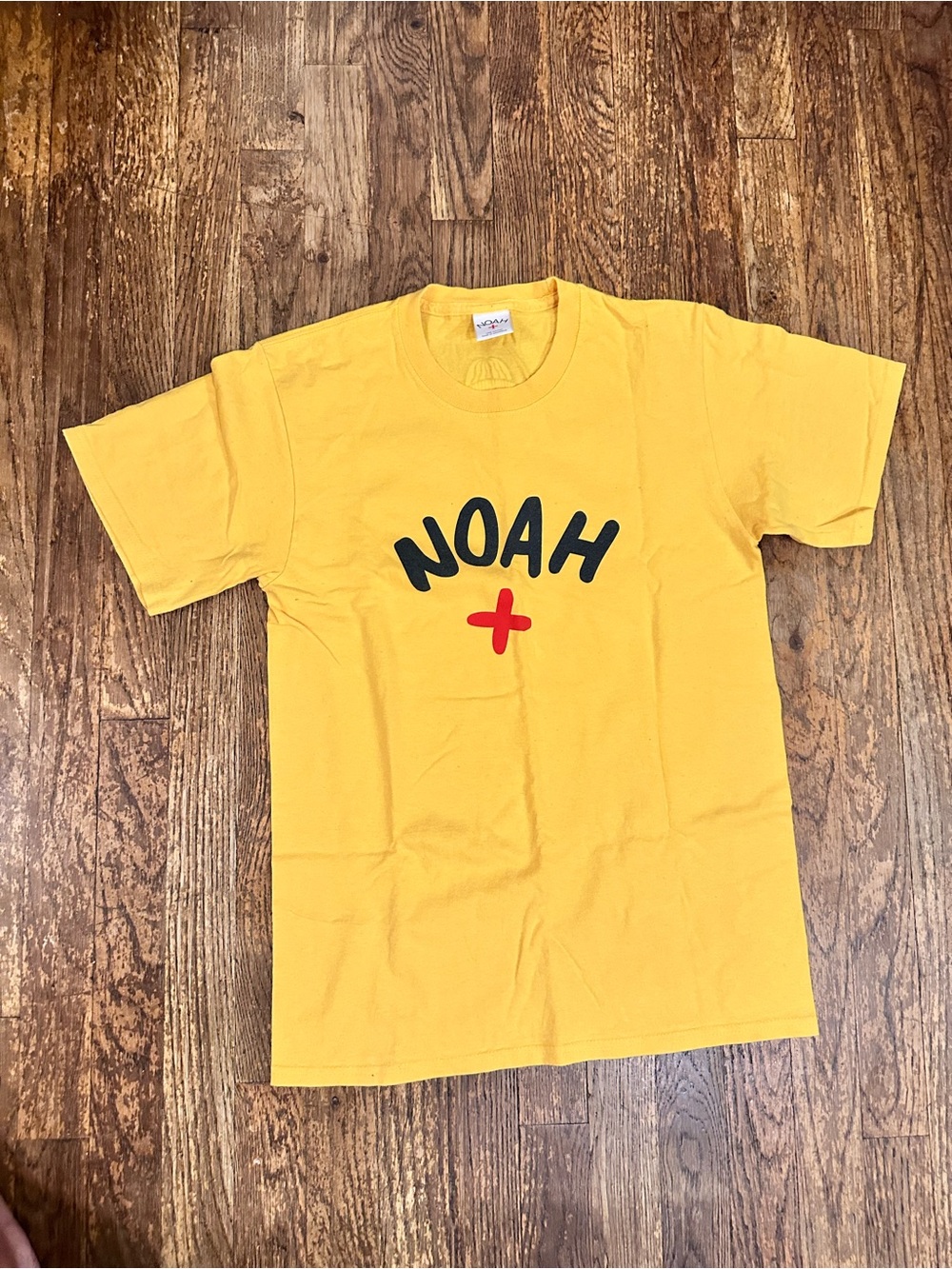 NOAH Men’s Small - Yellow Logo Tee with Red Cross